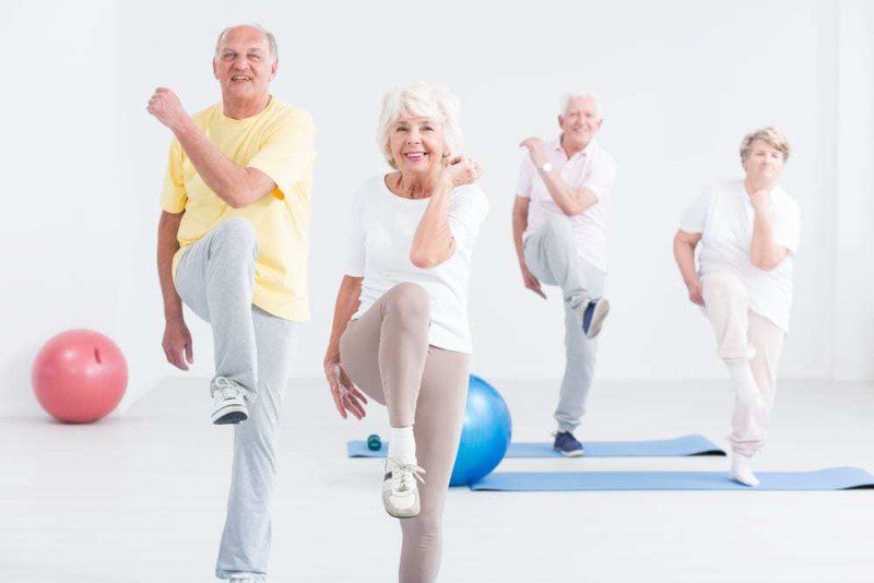 Senior Citizens Perform Balance Exercises